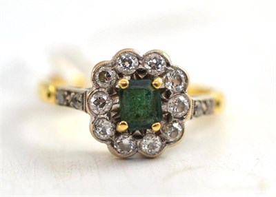 Lot 245 - An 18ct gold, emerald and diamond ring