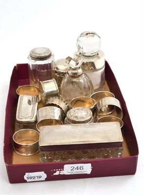 Lot 246 - A box of small silver, napkin rings, scent bottles etc