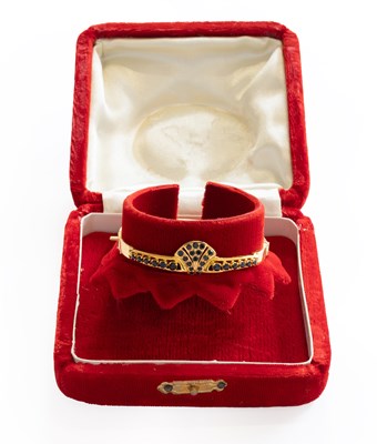 Lot 305 - A Hinged Sapphire Bangle, inner measurements 5....