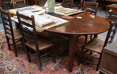 Lot 1200 - A Large Provincial Oak Dining Table, the oval...