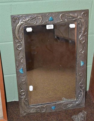 Lot 273 - An Arts & Crafts pewter embossed mirror inset with Ruskin buttons