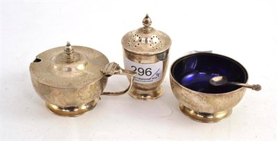 Lot 296 - A modern silver cruet set comprising salt, mustard and pepper; and a spoon (4)