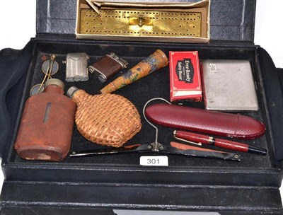 Lot 301 - A case of mixed collectables including Thorens patent lighter, Premier lighter, brass whist...