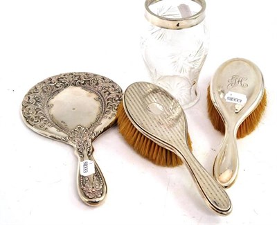 Lot 311 - Two silver backed brushes, a silver backed mirror and a glass vase with silver rim