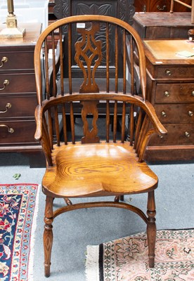 Lot 1301 - A 20th Century Elm Windsor Chair, with...