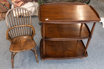 Lot 1165 - An Ercol Dark Elm Three Tier Drinks Trolley,...