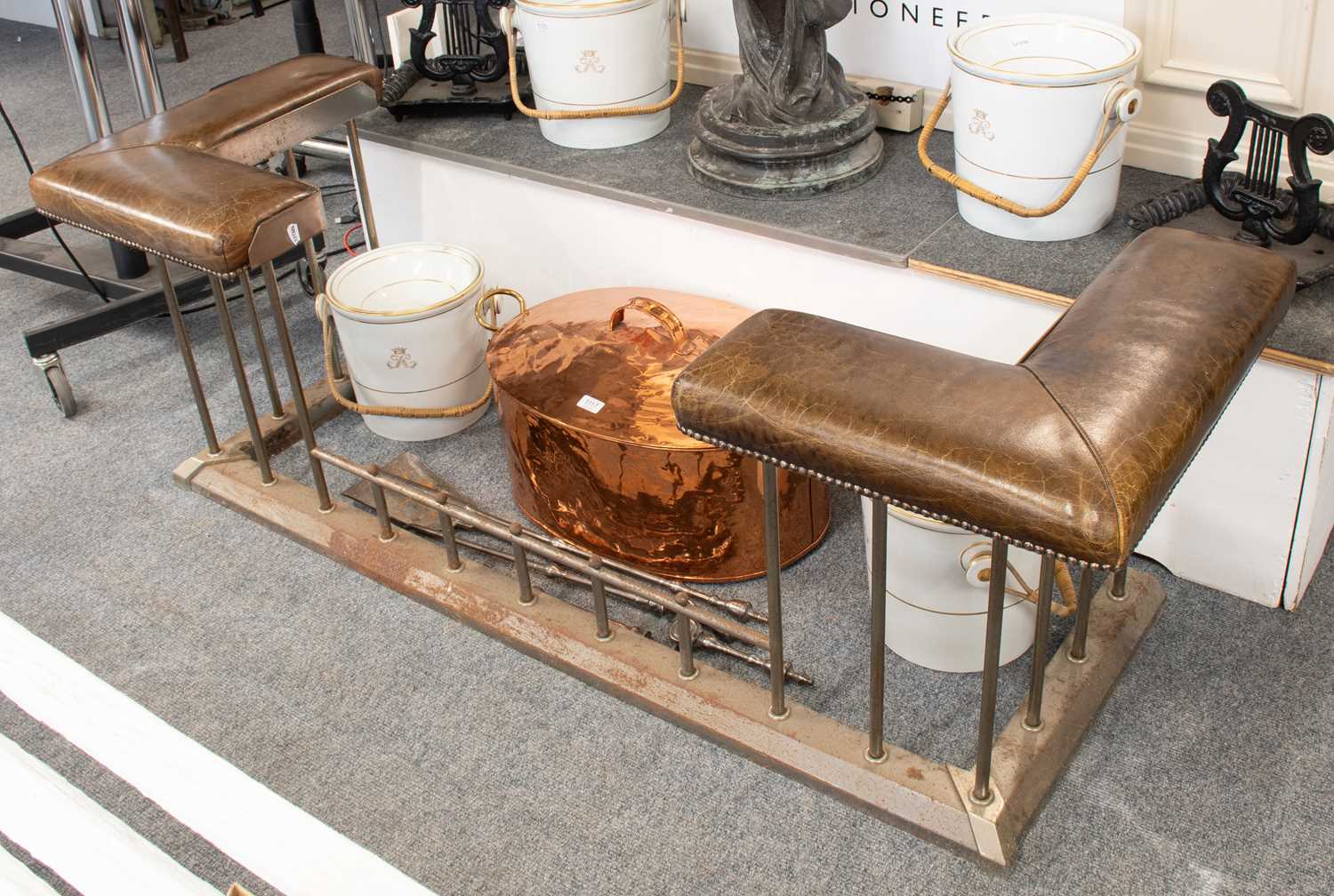 Lot 1113 - A Steel and Brown Leather Club Fender, 170cm...
