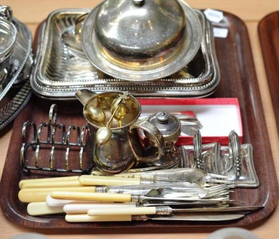 Lot 323 - Ten Georgian silver teaspoons, two silver plated entree dishes, muffin dish, toast rack etc