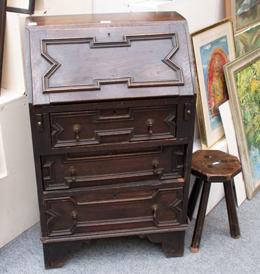 Lot 1208 - A Small Carved Oak Bureau in 17th Century...