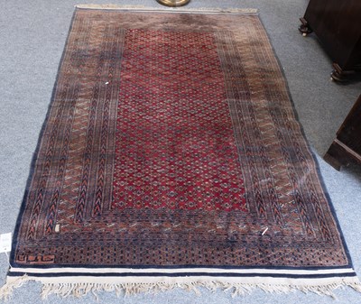 Lot 1015 - "Bukhara" Rug, the blood red field with an...