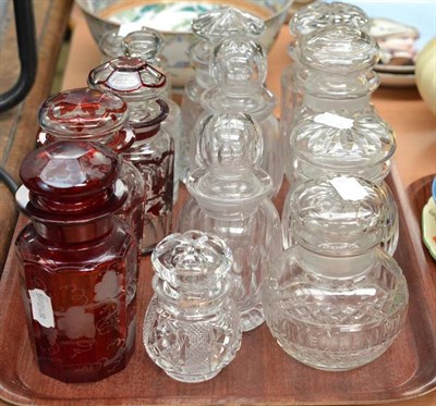 Lot 338 - Ten clear glass preserve jars and covers, a small decanter and stopper, three Bohemian ruby flashed