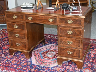 Lot 474 - A Figured Walnut Leather Inset Twin-pedestal...