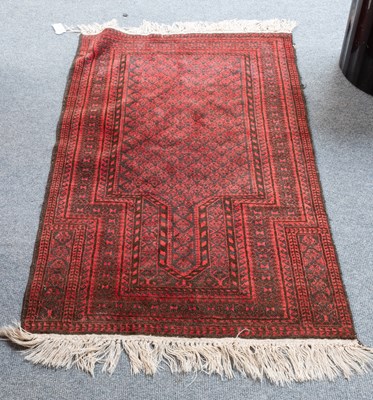 Lot 1270 - Baluch Prayer Rug, the charcoal field of...