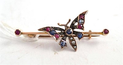 Lot 360 - A 9ct gold seed pearl, diamond and ruby bar brooch in the form of a butterfly