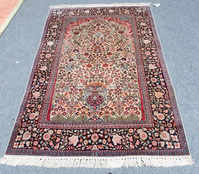 Lot 1278 - Kashmir Silk-Piled Prayer Rug, the ivory field...