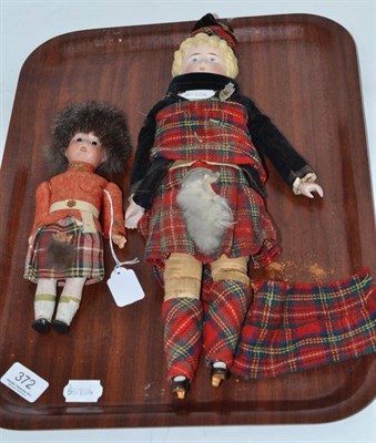 Lot 372 - Bisque shoulder head doll in highland dress, with moulded blond hair, painted face, bisque...