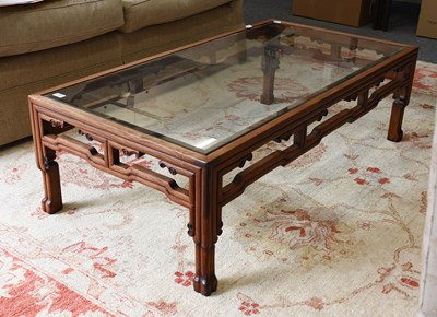 Lot 1395 - A Chinese Hardwood Coffee Table, carved with...