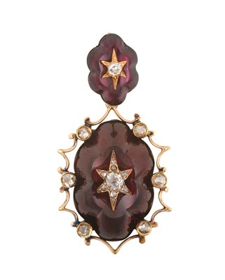 Lot 2461 - A Garnet and Diamond Pendant the scalloped...