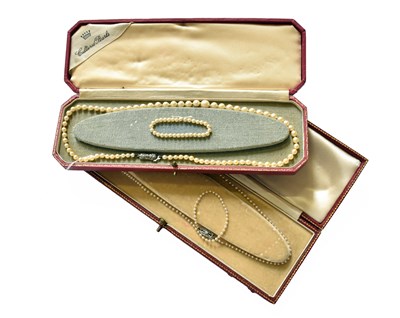Lot 234 - A Graduated Pearl Necklace, with a diamond set...