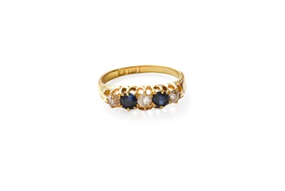 Lot 244 - An 18 Carat Gold Sapphire and Diamond Five...
