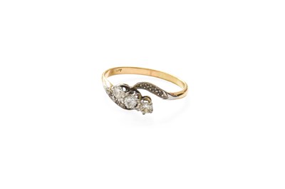 Lot 253 - A Diamond Three Stone Twist Ring, the round...