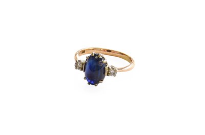 Lot 390 - A Synthetic Sapphire and Diamond Three Stone...