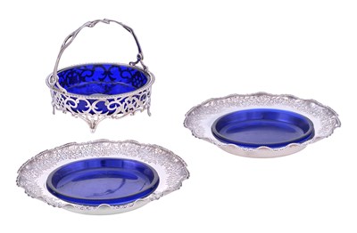 Lot 101 - A Cased Pair of Victorian Silver Butter-Dishes