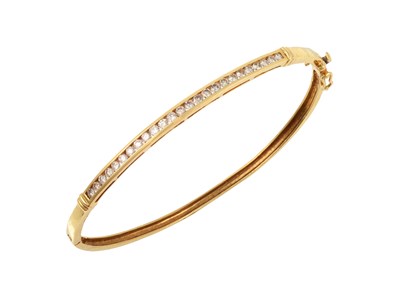 Lot 2293 - An 18 Carat Gold Diamond Bangle the round...