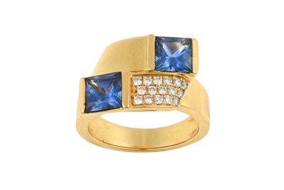 Lot 2379 - A Sapphire and Diamond Ring of crossover form,...