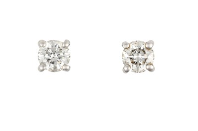 Lot 2371 - A Pair of Diamond Solitaire Earrings the round...