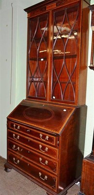 Lot 435 - A 19th century inlaid mahogany glazed bureau bookcase