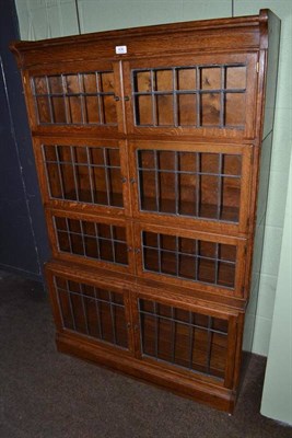 Lot 436 - Oak sectional reeded glass door bookcase