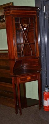 Lot 438 - An Edwardian mahogany satinwood banded free standing corner cupboard