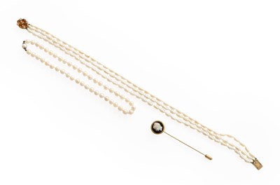 Lot 360 - A Triple Row Cultured Pearl Necklace, knotted...