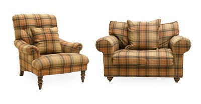 Lot 608 - A Modern Snuggle Armchair, covered in brown...