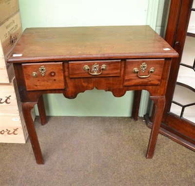 Lot 452 - A 18th century mahogany lowboy