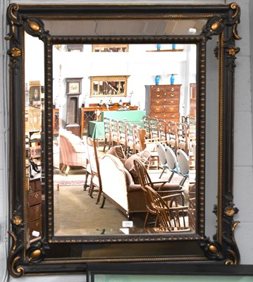 Lot 1282 - A Sectional Cushion-Shaped Wall Mirror, in...
