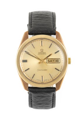 Lot 2276 - Omega: A 9 Carat Gold Automatic Day/Date...