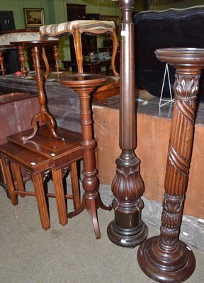 Lot 472 - A reproduction nest of tables; standard lamp; two mahogany torcheres; and a tripod table