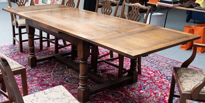 Lot 1408 - A Reproduction Oak Draw Leaf Dining Table,...