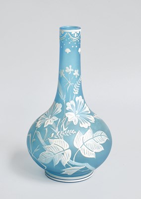 Lot 255 - A Blue Satin Glass Bottle Vase, with white...