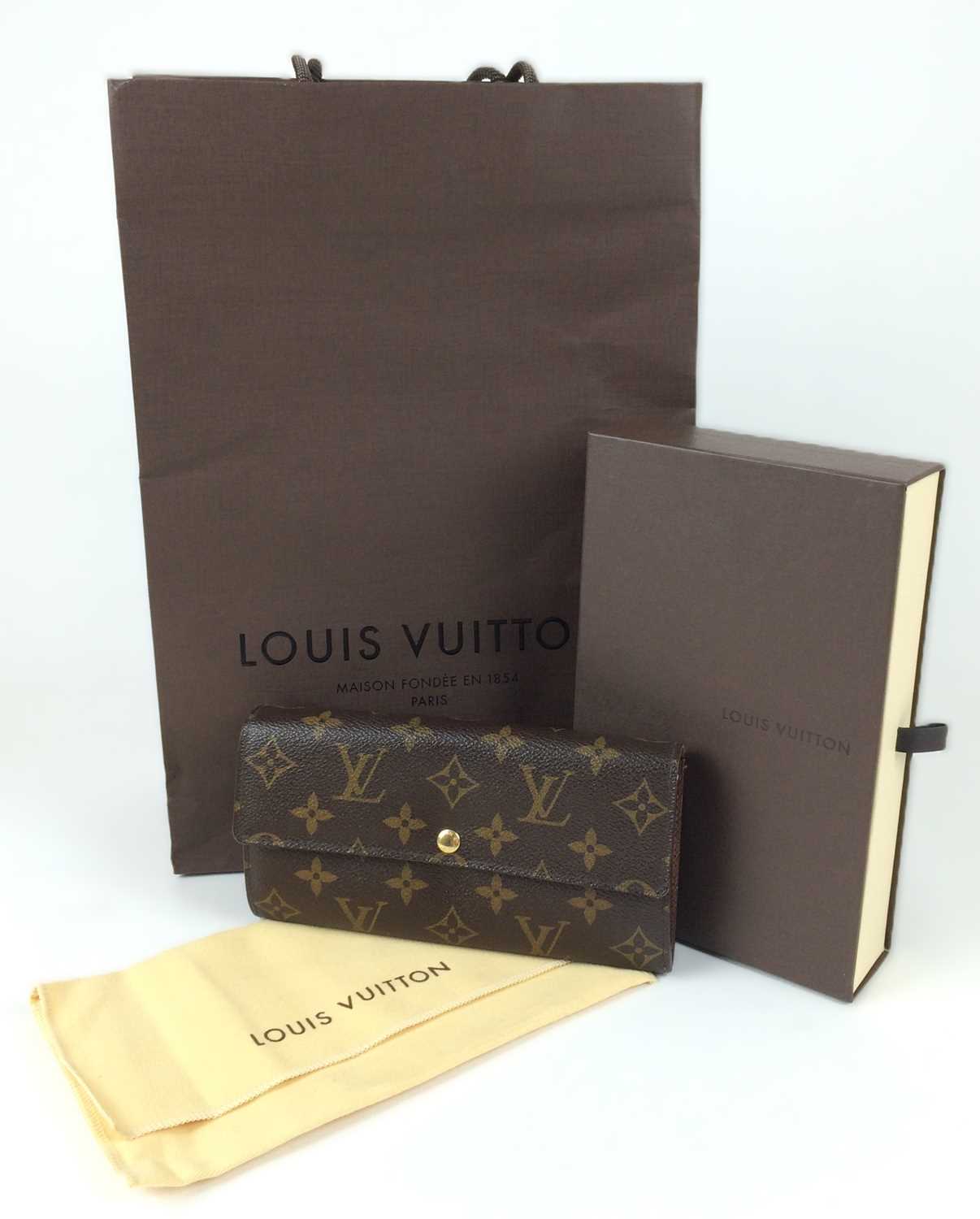 Lot 1048 - Louis Vuitton Sarah Logo Leather Wallet, with...