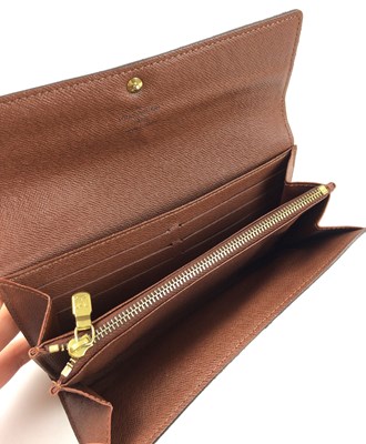Lot 1048 - Louis Vuitton Sarah Logo Leather Wallet, with...