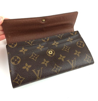 Lot 1048 - Louis Vuitton Sarah Logo Leather Wallet, with...