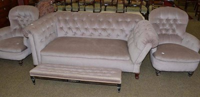 Lot 504 - A pair of button back upholstered low easy chairs and a button back Chesterfield and footstool...