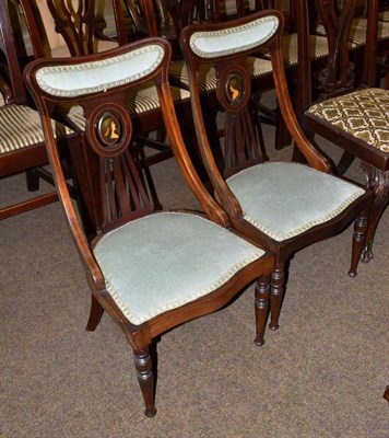 Lot 509 - A pair of Edwardian mahogany nursing chairs with portrait medallion backs