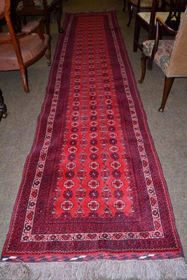 Lot 514 - A red ground runner