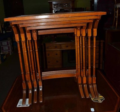 Lot 519 - Modern Bradley yew wood nest of four tables