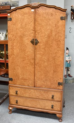 Lot 534 - A Burr Walnut Compactum Wardrobe, with shaped...