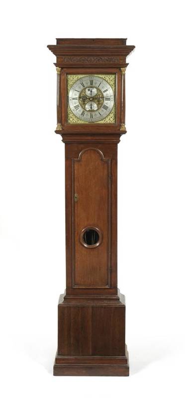 Lot 1055 - An Eight Day Longcase Clock, caddied pediment, arched trunk door with glazed lenticle, 12-inch...